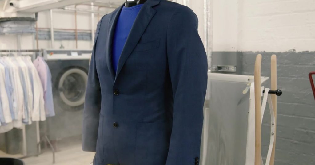 A dry cleaned suit ready for collection.