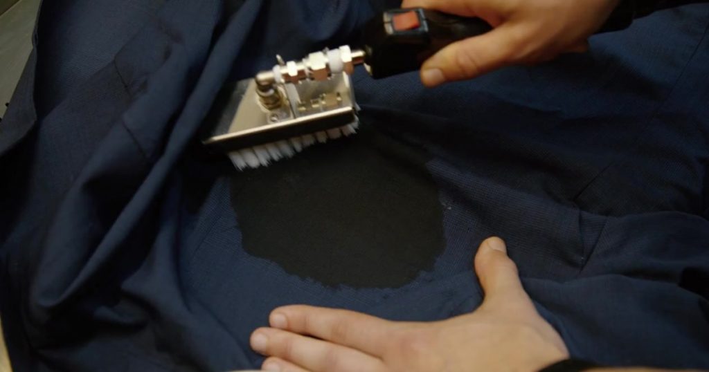 Treatment of stains before dry cleaning.