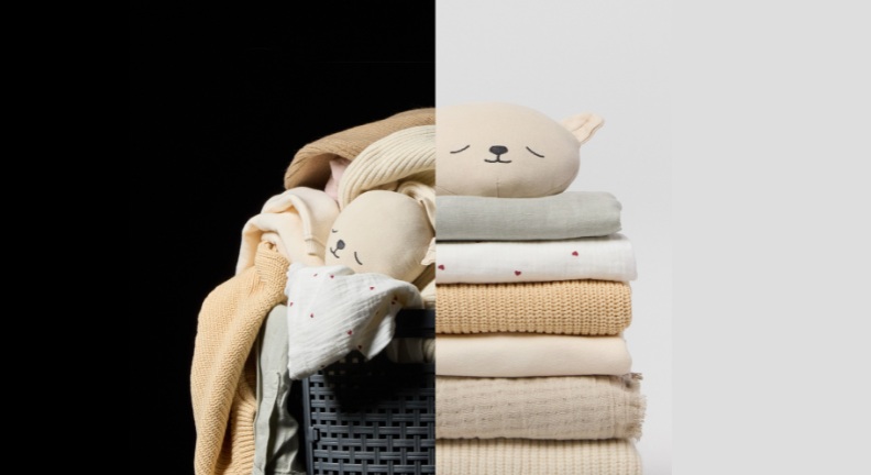 Laundry basket with unfolded clothes and washed folded clothes next to it.